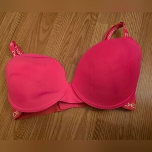 Bebe Women's Bra 36DD in pink with bebe lettering on the edges.